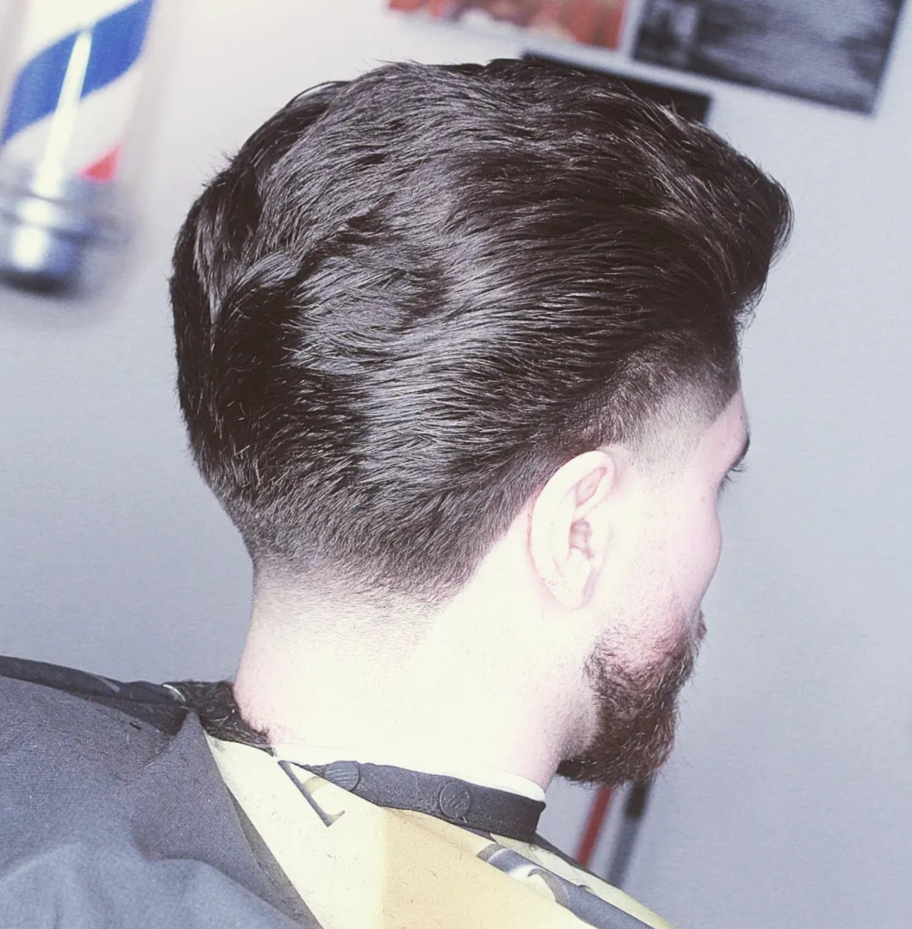 Man with a modern pompadour hairstyle, combining classic elegance with a contemporary twist in Ontario.