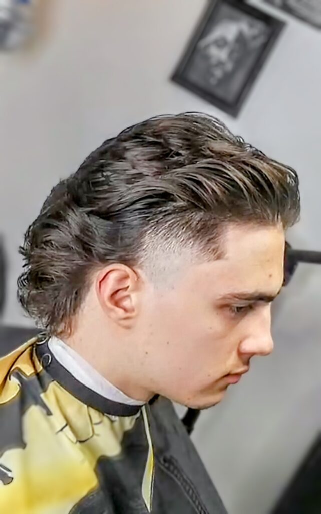 Man with a faded mullet, blending retro vibes with a modern twist in Ontario.