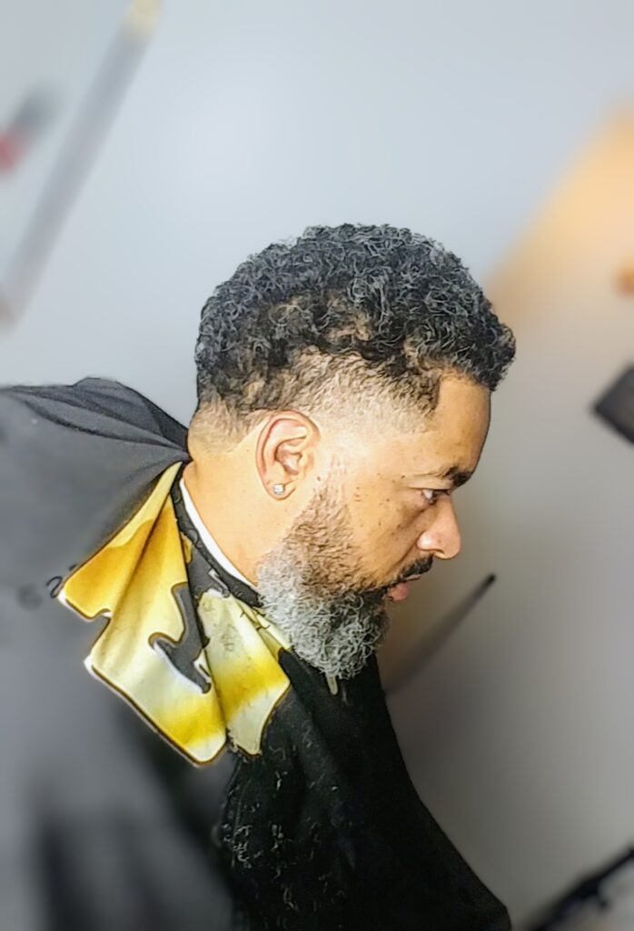 Man with a classic taper hairstyle, emphasizing clean lines and a neat appearance in Ontario.